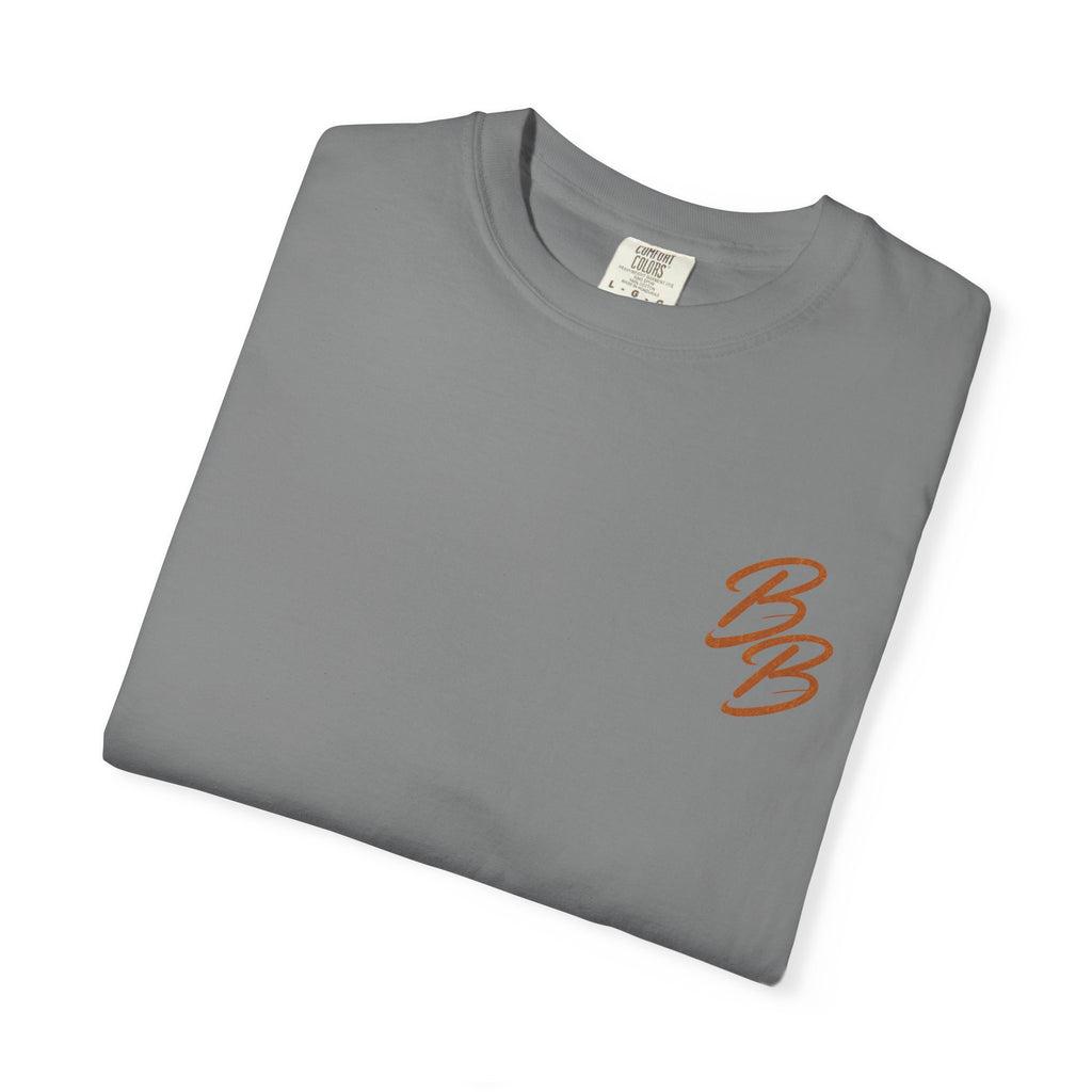 Dark gray T-shirt with orange script logo on left chest, folded