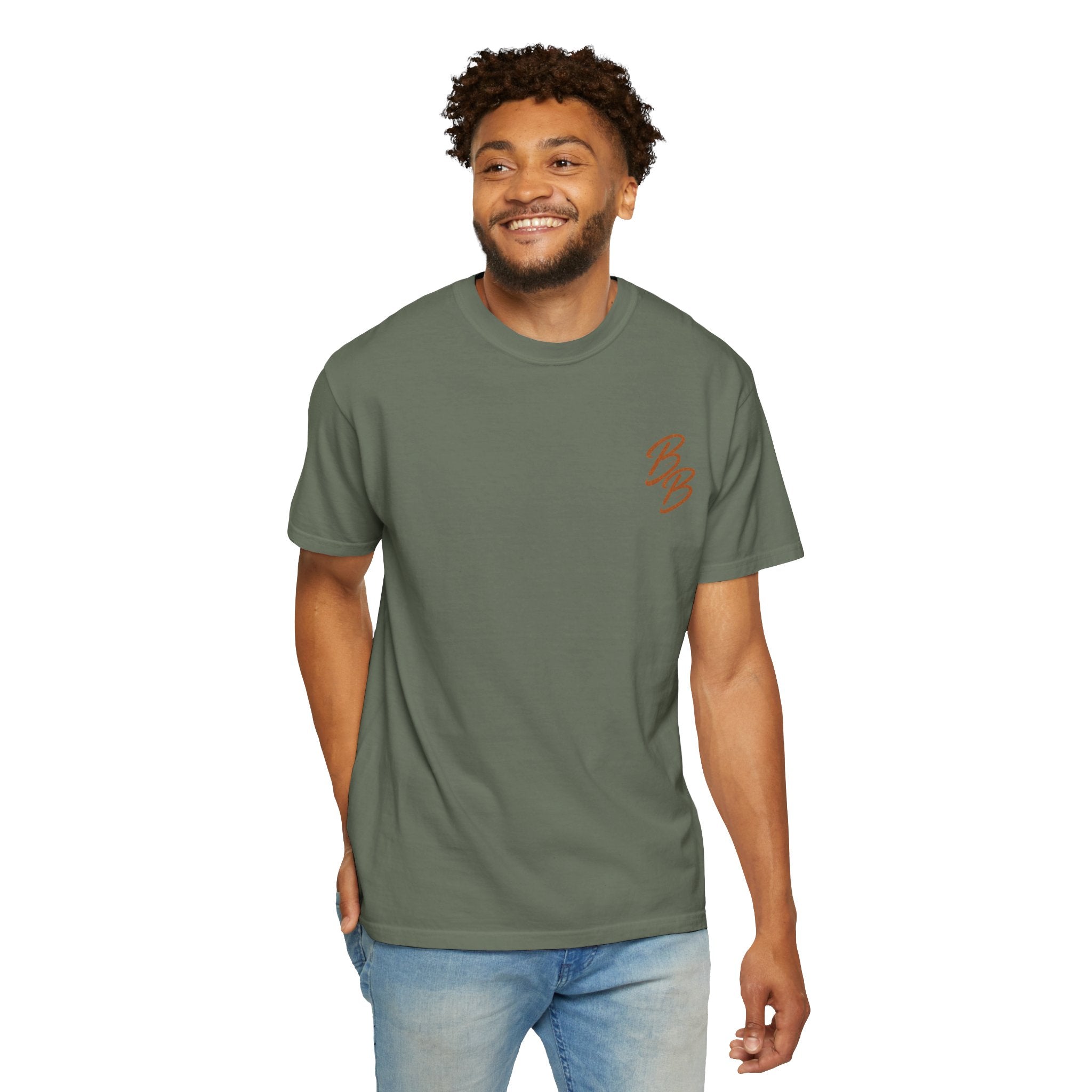 Green T-shirt with orange script logo on left chest, worn by model