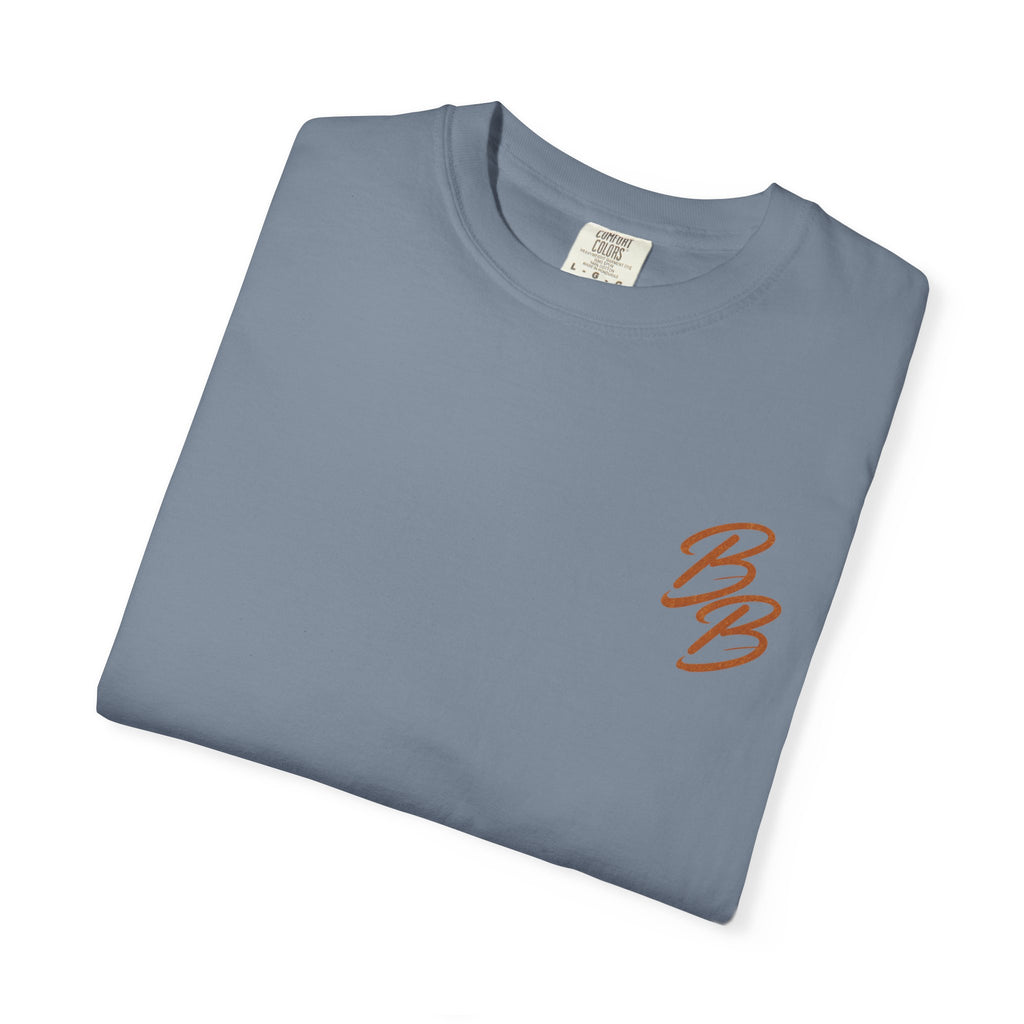 Light blue crew neck T-shirt with small orange B logo on left chest (folded view)