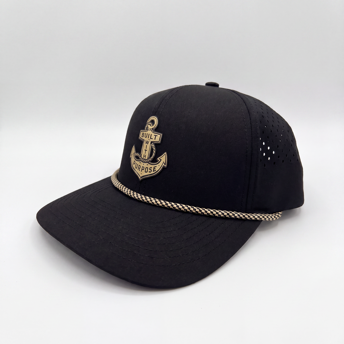 Black anchor baseball cap with gold crest patch, perforated crown, braided brim trim