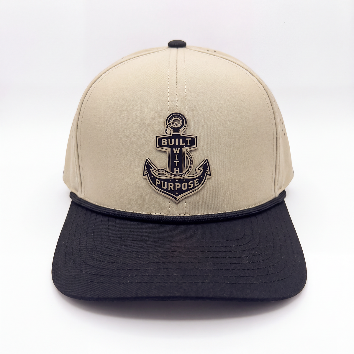 Sand and black baseball cap with front anchor emblem and curved dark brim